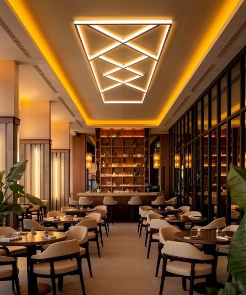 Warm Modern Restaurant Interior with Statement Ceiling Lights